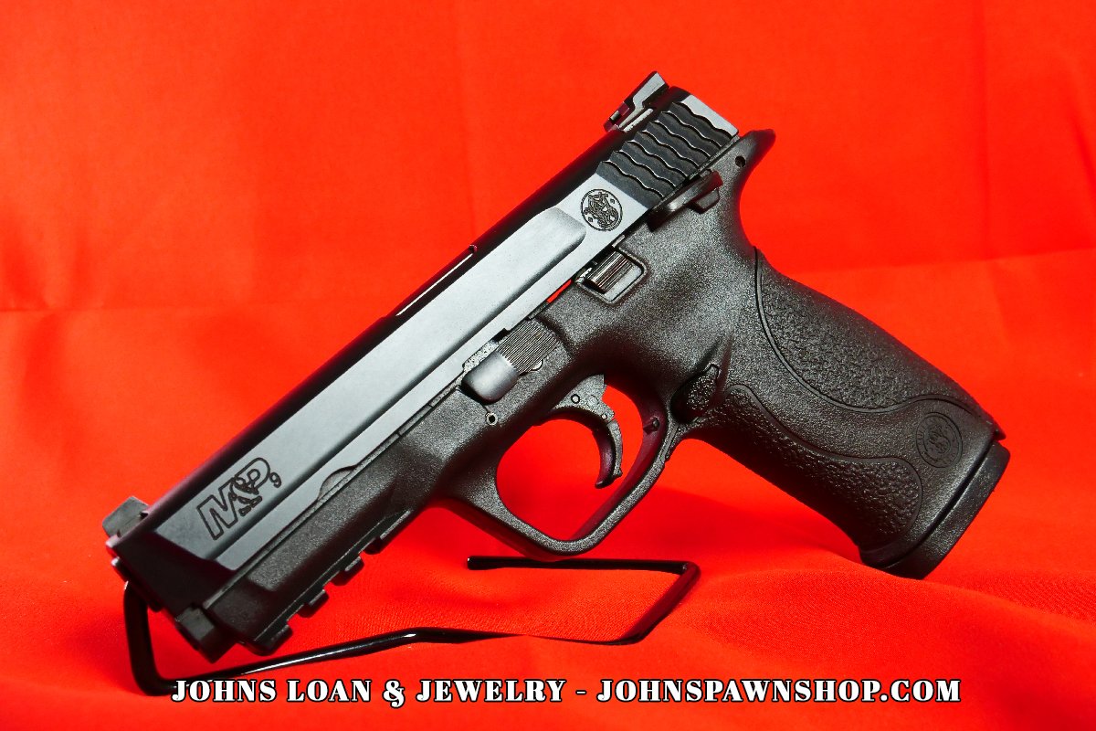 Smith & Wesson Military & Police 9mm semi-auto pistol in excellent shape, showcasing the firearm's sleek design. Available at John's Loan & Jewelry, your Las Vegas pawn shop.