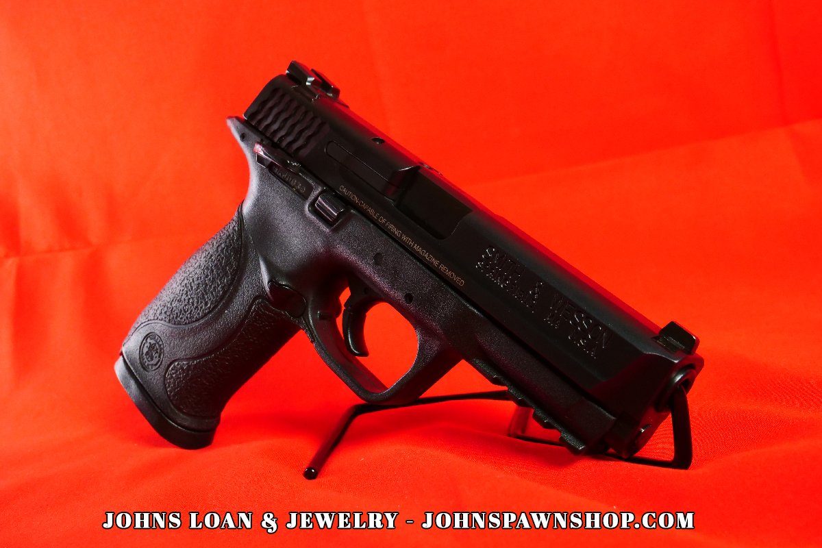 Full view of the Smith & Wesson Military & Police 9mm semi-auto pistol in excellent shape, featuring the pistol's slide and frame. Available at John's Loan & Jewelry.