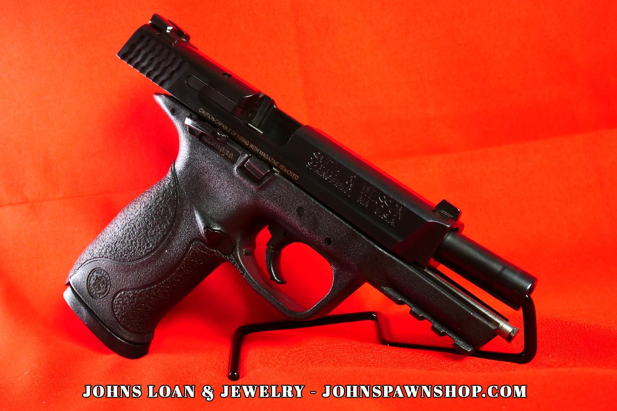 Smith & Wesson Military & Police 9mm semi-auto pistol in excellent shape, showcasing the pistol's slide and frame. Available at John's Loan & Jewelry.